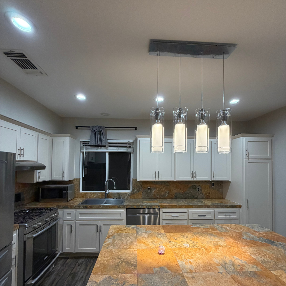 Freshly painted white kitchen cabinets and trim